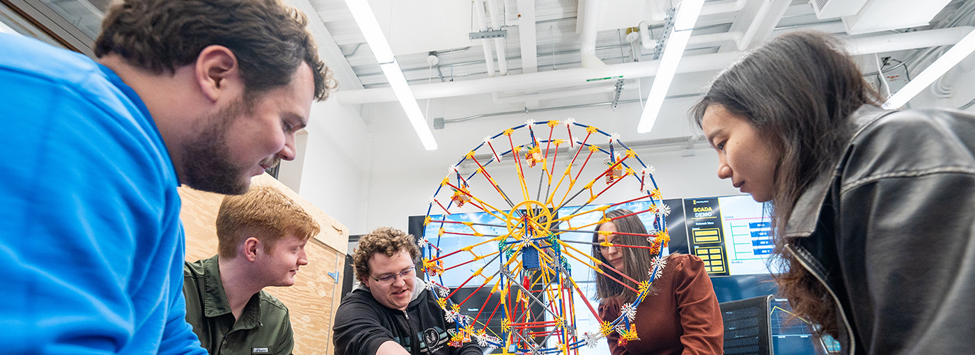 Students build a model ferris wheel for use in cybersecurity research